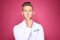 man in white suit jacket