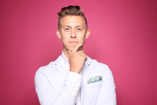 real estate agent in white suit jacket