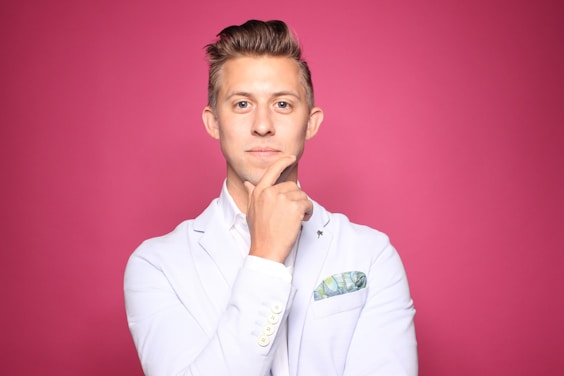 real estate agent in white suit jacket