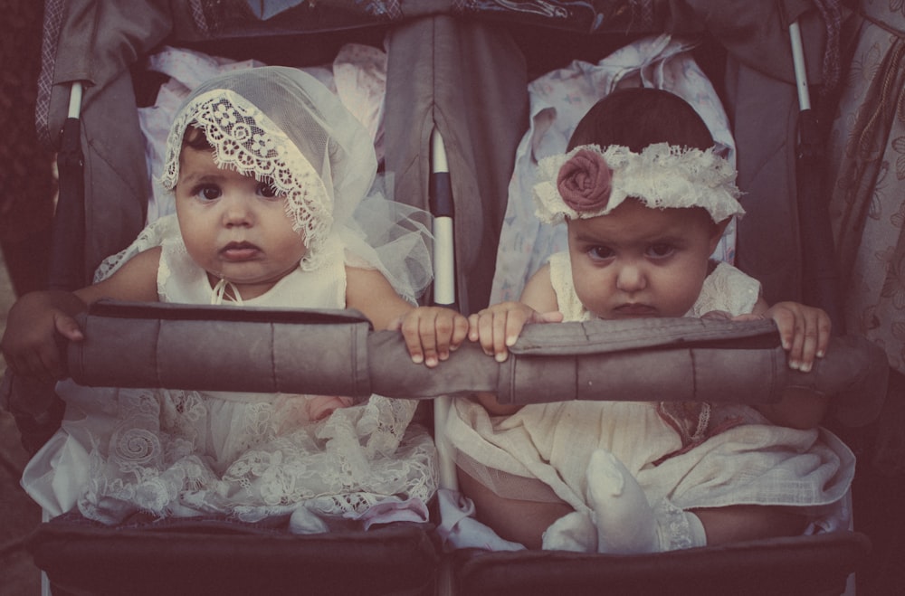 two girls on twin stroller