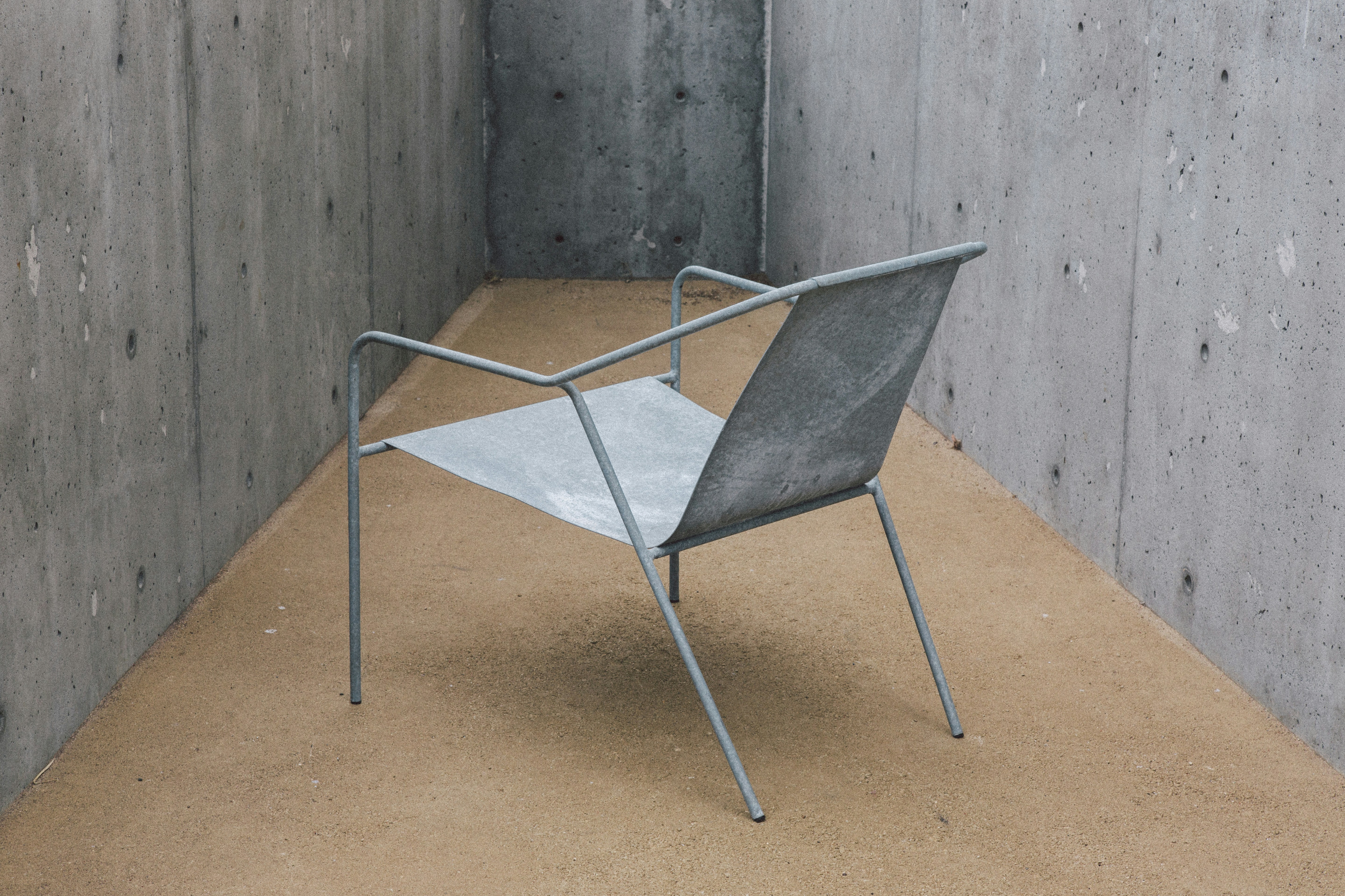 Gray metal armchair