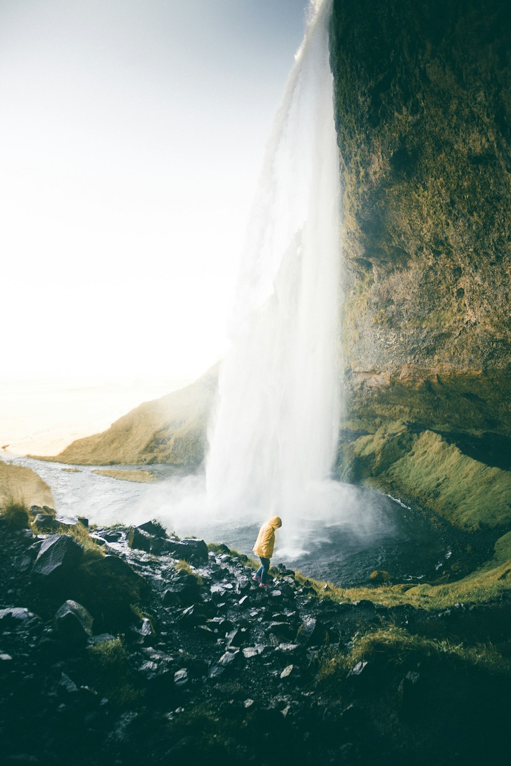 person near waterfalls