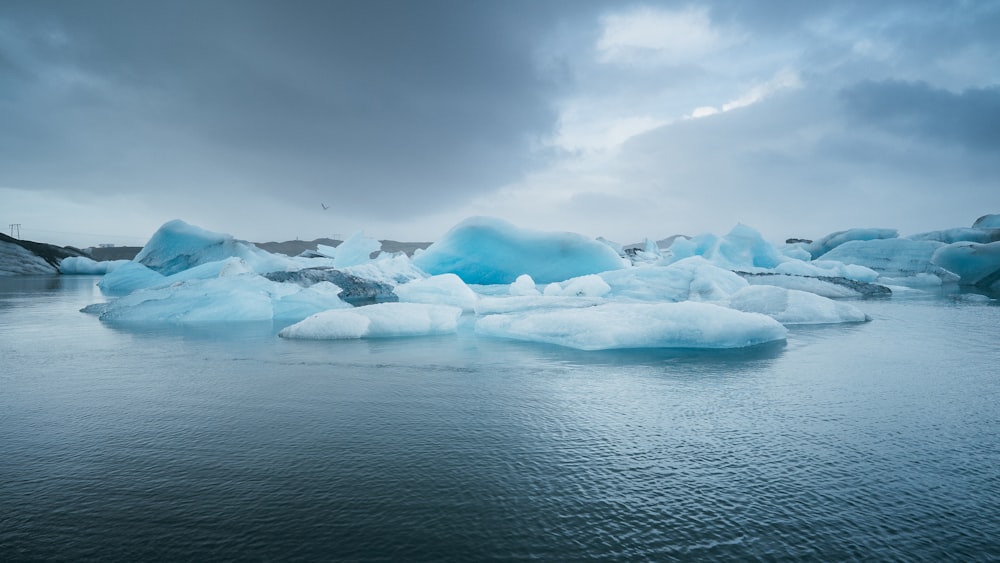 grayscale photography of sea under nimbus clouds