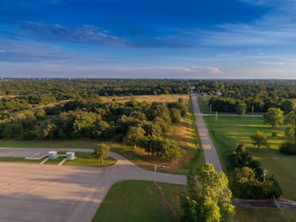 Empty plot of land with clear sky and nearby road