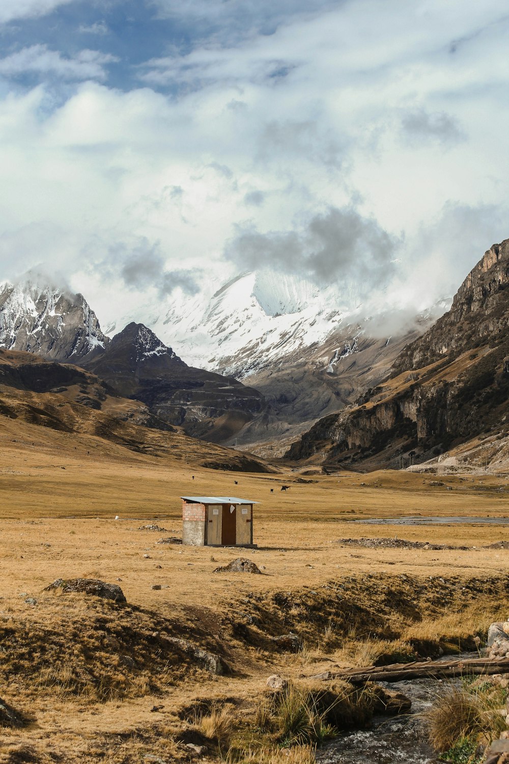 brown wooden storage room beside mountains