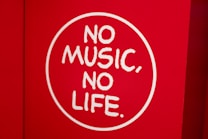 A red background features a white circle with the phrase 'NO MUSIC, NO LIFE' written in bold, white letters.