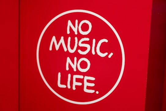 A red background features a white circle with the phrase 'NO MUSIC, NO LIFE' written in bold, white letters.