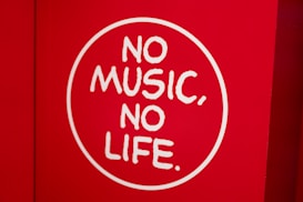 A red background features a white circle with the phrase 'NO MUSIC, NO LIFE' written in bold, white letters.