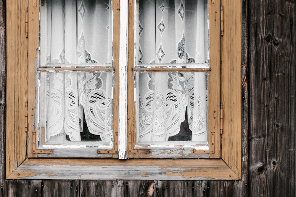 clear glass windows with brown wooden frame