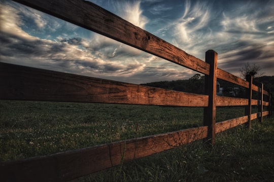 brown wooden fence beside green grass field in Honey Brook United States