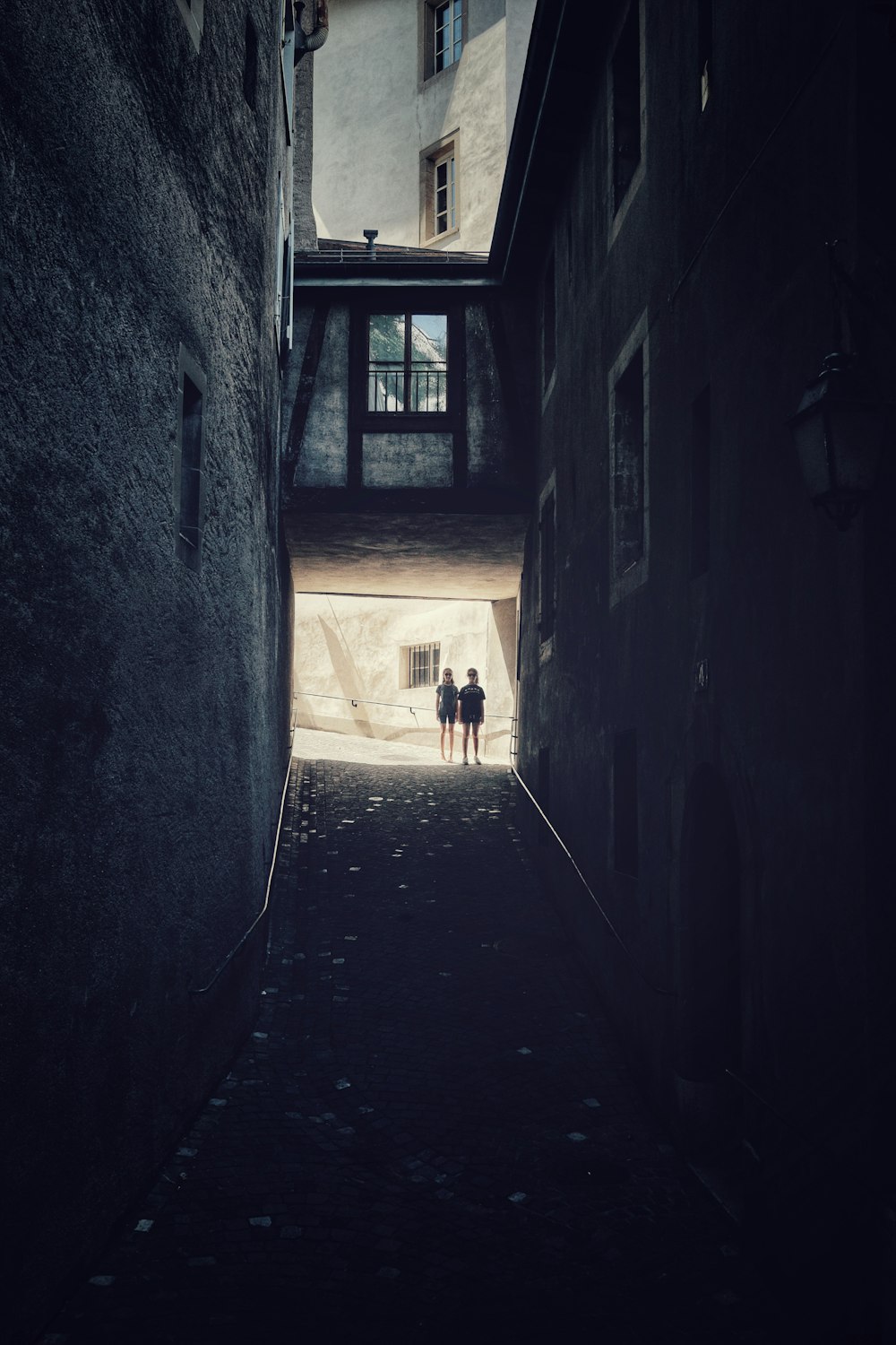 two person standing near wall