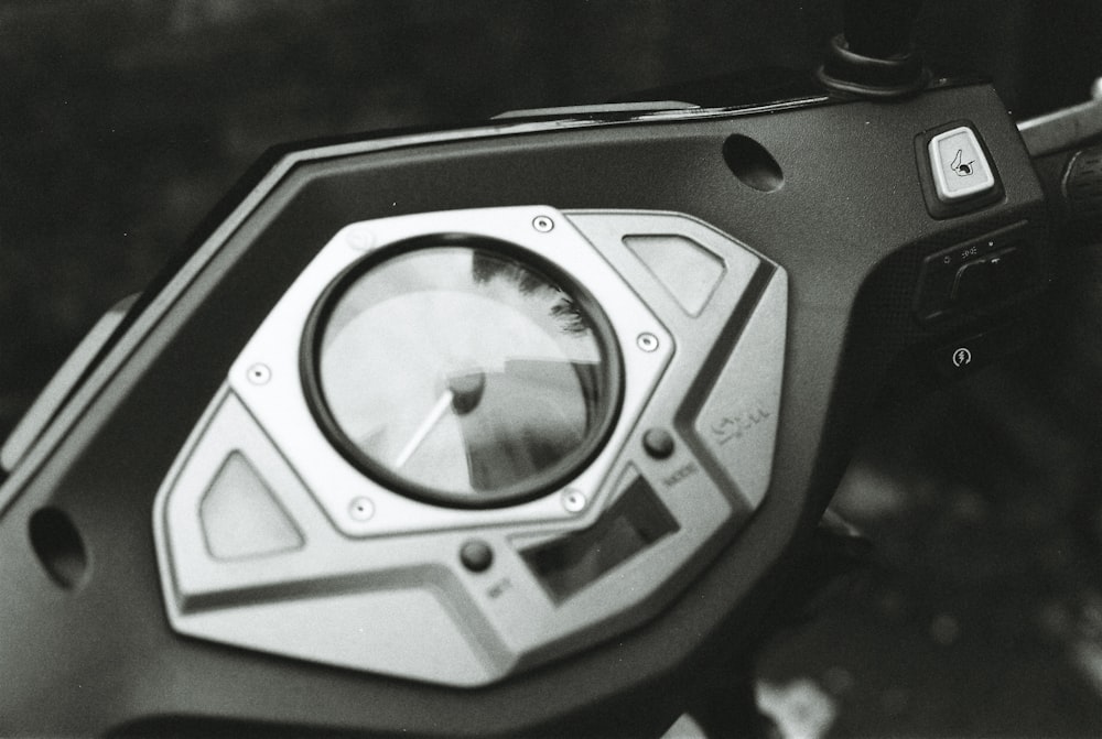 grayscale photo of digital motorcycle odometer