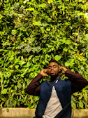 Happy customer enjoying a Verdevibe product outdoors, surrounded by lush greenery and urban vibes.