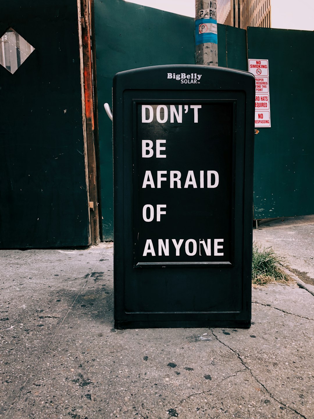 motivational quote signage on street at daytime