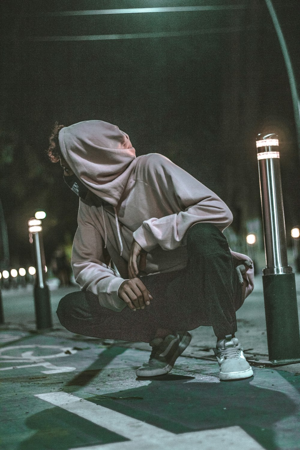 man sitting outdoor during nighttime