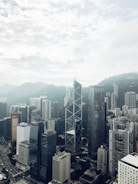 A vibrant aerial view of a bustling Indian city skyline with diverse residential and commercial buildings.