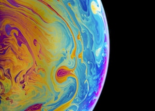 multicolored planet closeup photography