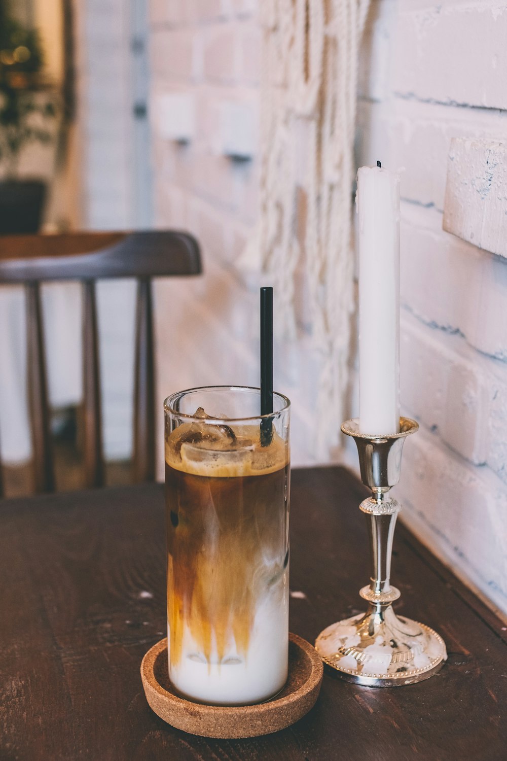 clear drinking glass on brown surface