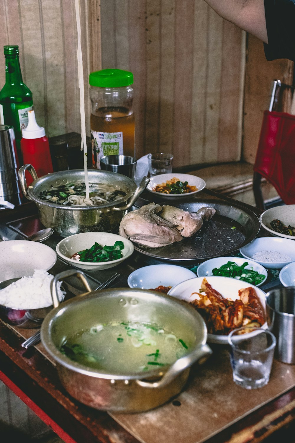 cooked foods on plates beside red chair