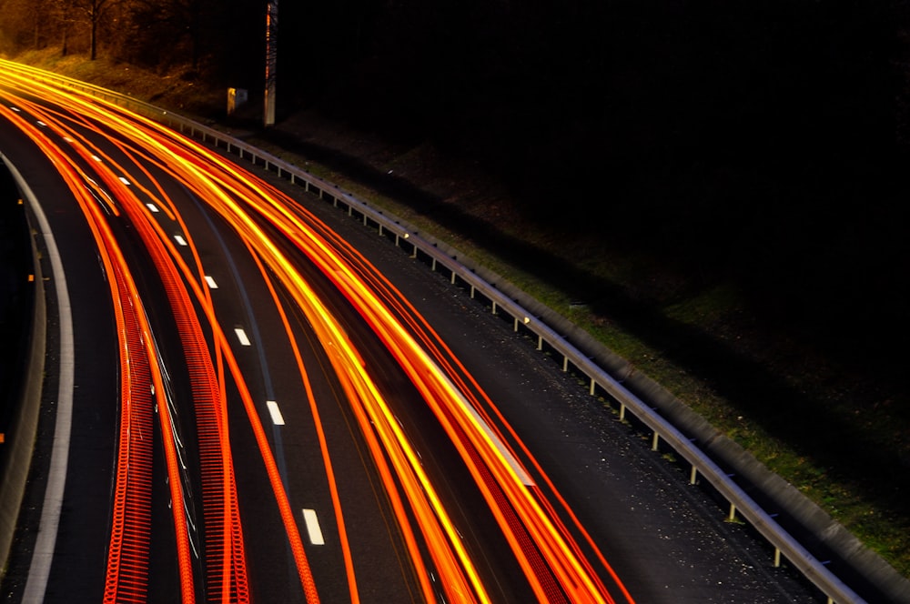 timelapse photography of vehicle taillights on road during night time