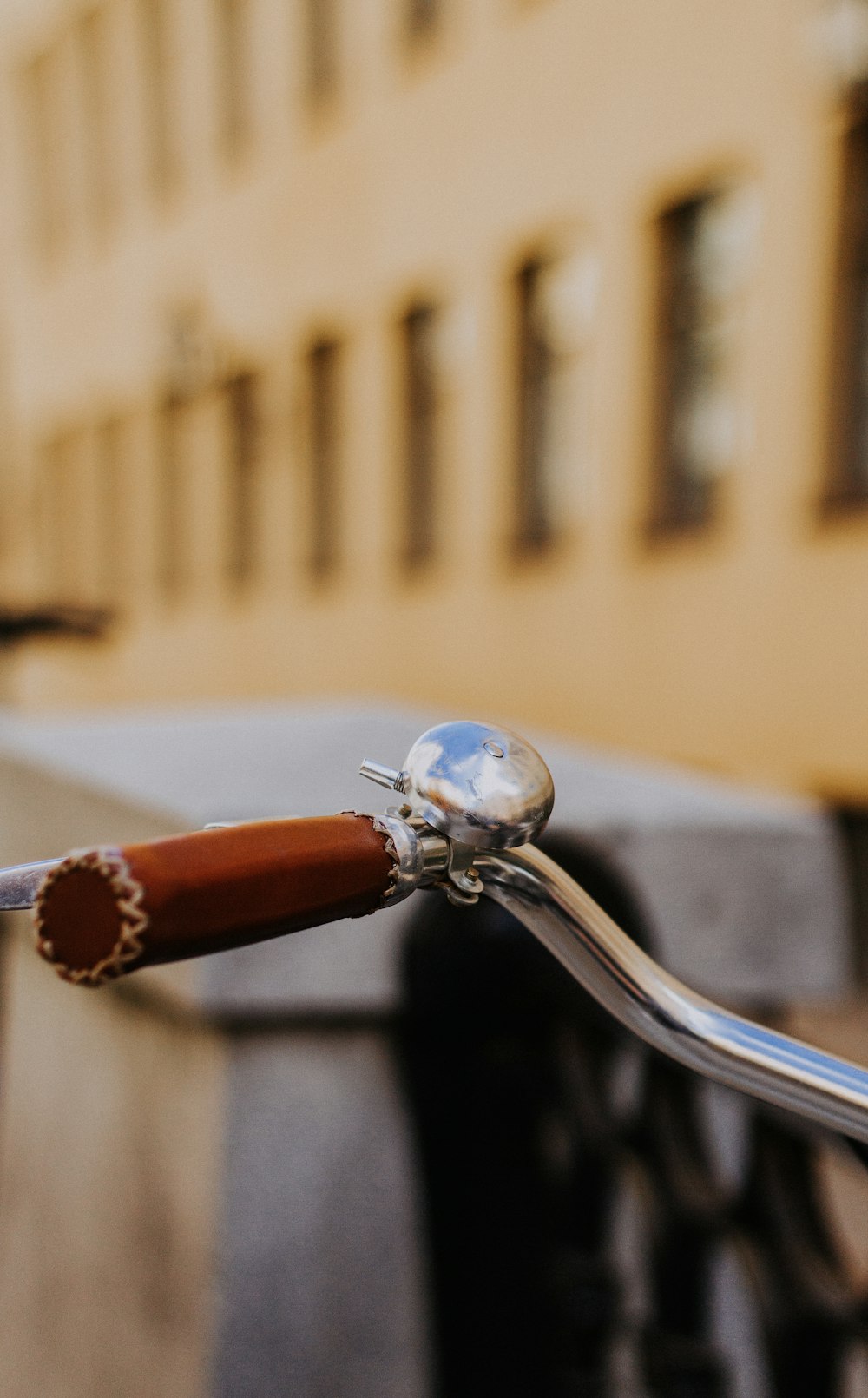 shallow focus photography of bicycle bell