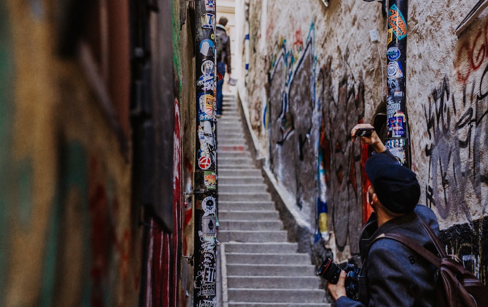 man standing in front of stairs