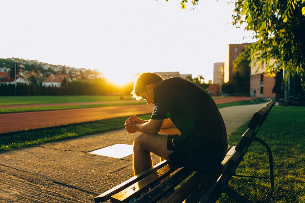 man sitting on bench