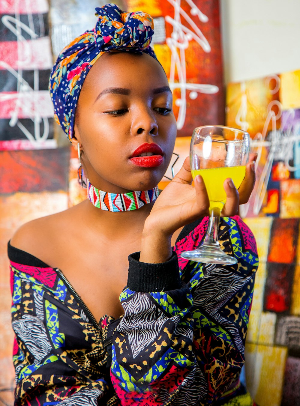 woman holding glass of juice