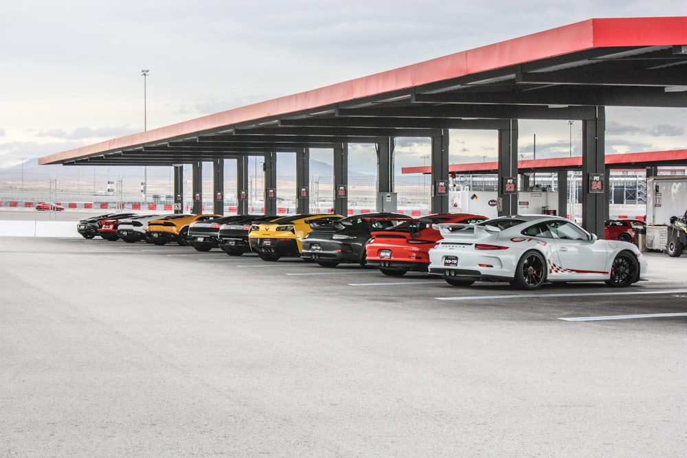 vehicle parks under red roof