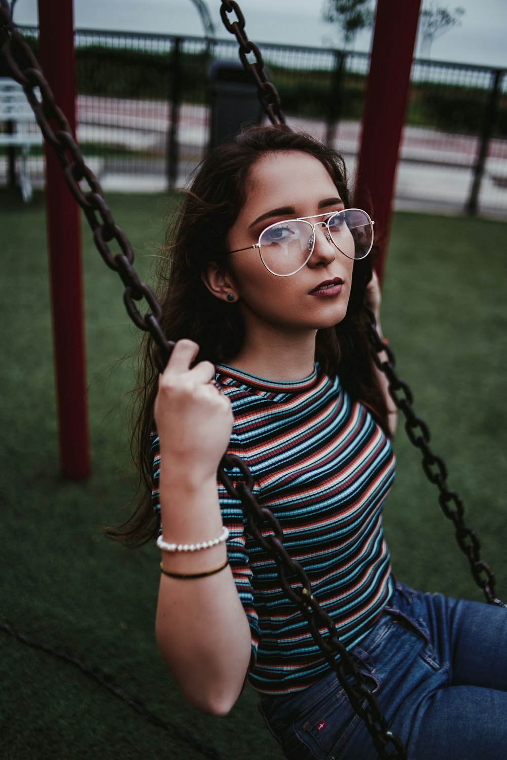 woman sits on swing