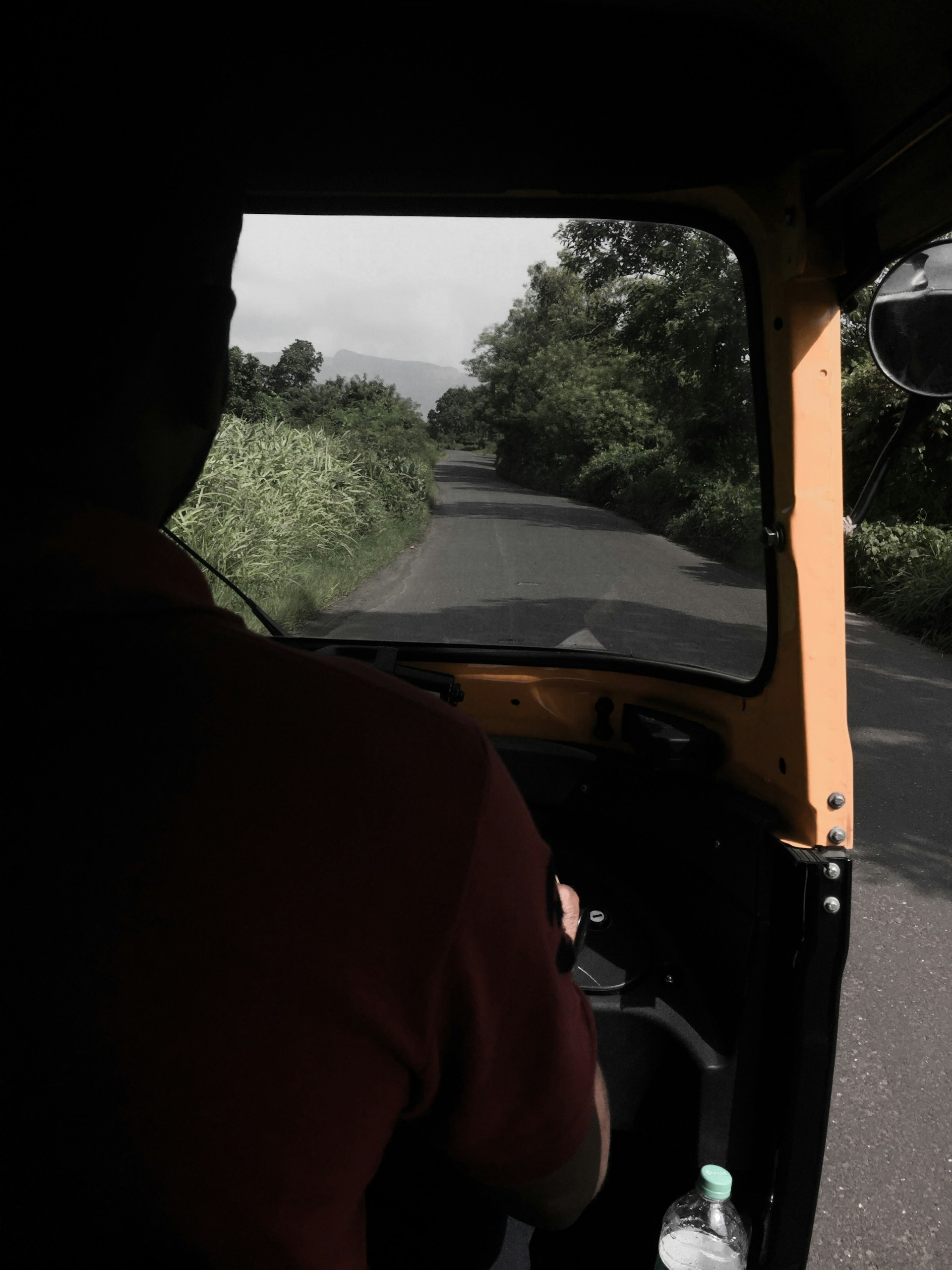 woman wearing yellow long-sleeved dress under white clouds and blue sky during daytime