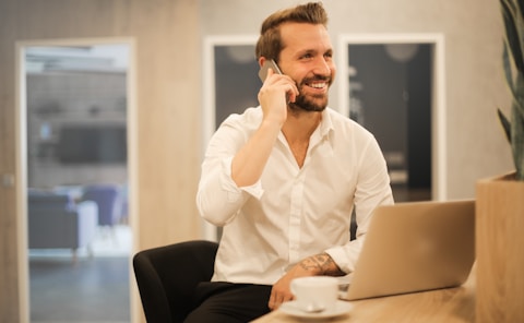 man using smartphone on chair