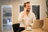 man using smartphone on chair