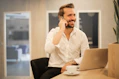 man using smartphone on chair