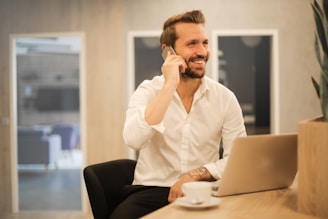 man using smartphone on chair