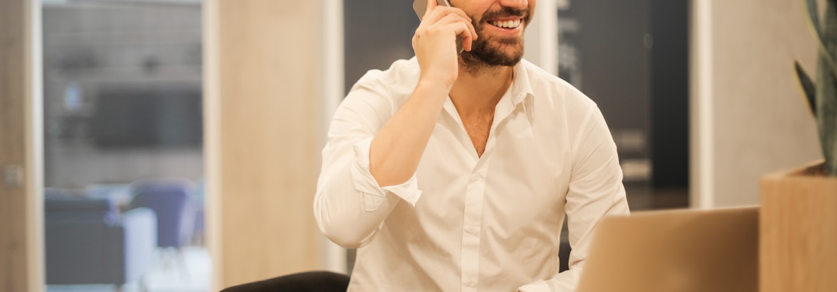 man using smartphone on chair