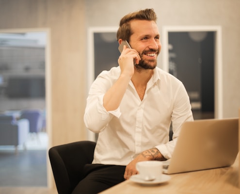 man using smartphone on chair