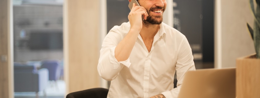 man using smartphone on chair