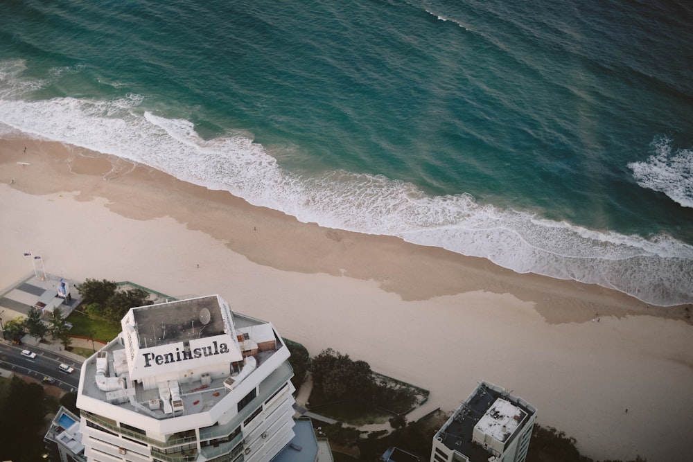 aerial photo of Peninsula building near beach