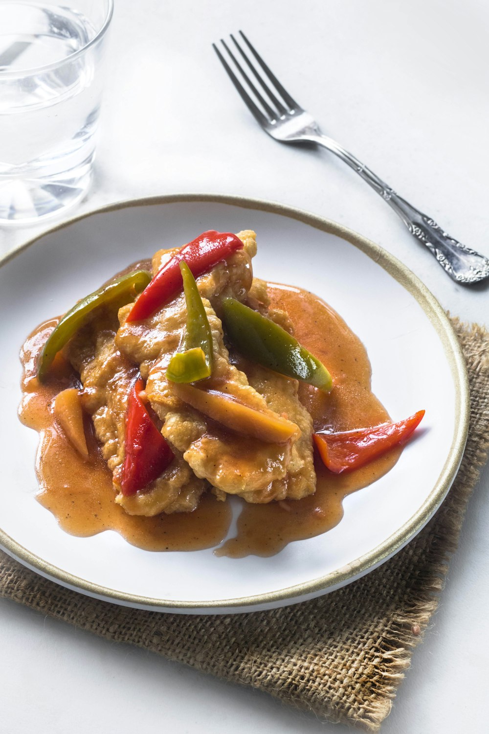 meat dish on round white plate