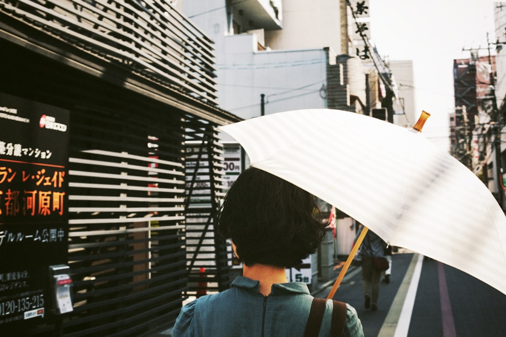 woman holding umbrella