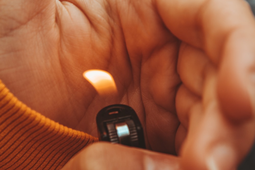 person holding lightened lighter