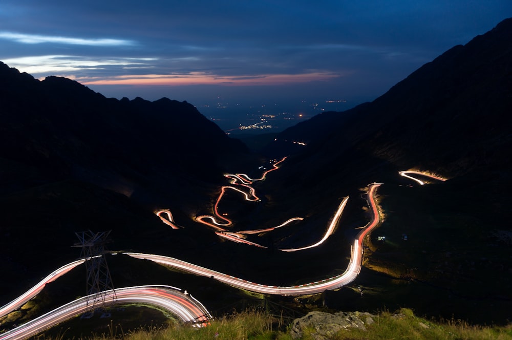 light photography of road near the mountain