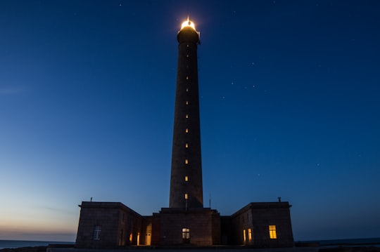 gray concrete building under blue sky in Gatteville Lighthouse France