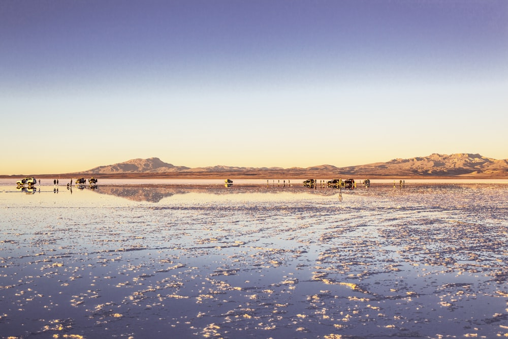 body of water with mountain at distance