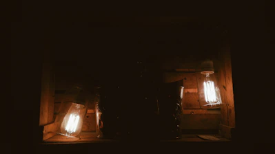 A softly glowing scoop-shaped box with a warm coral hue, hinting at hidden treasures inside.