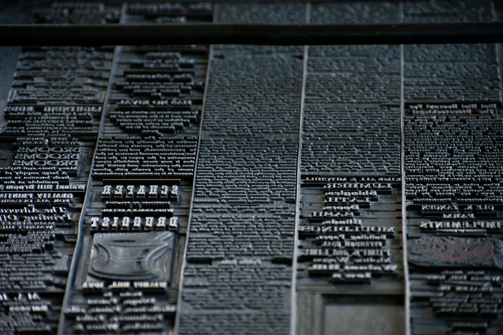 a close up of a wall with many names on it
