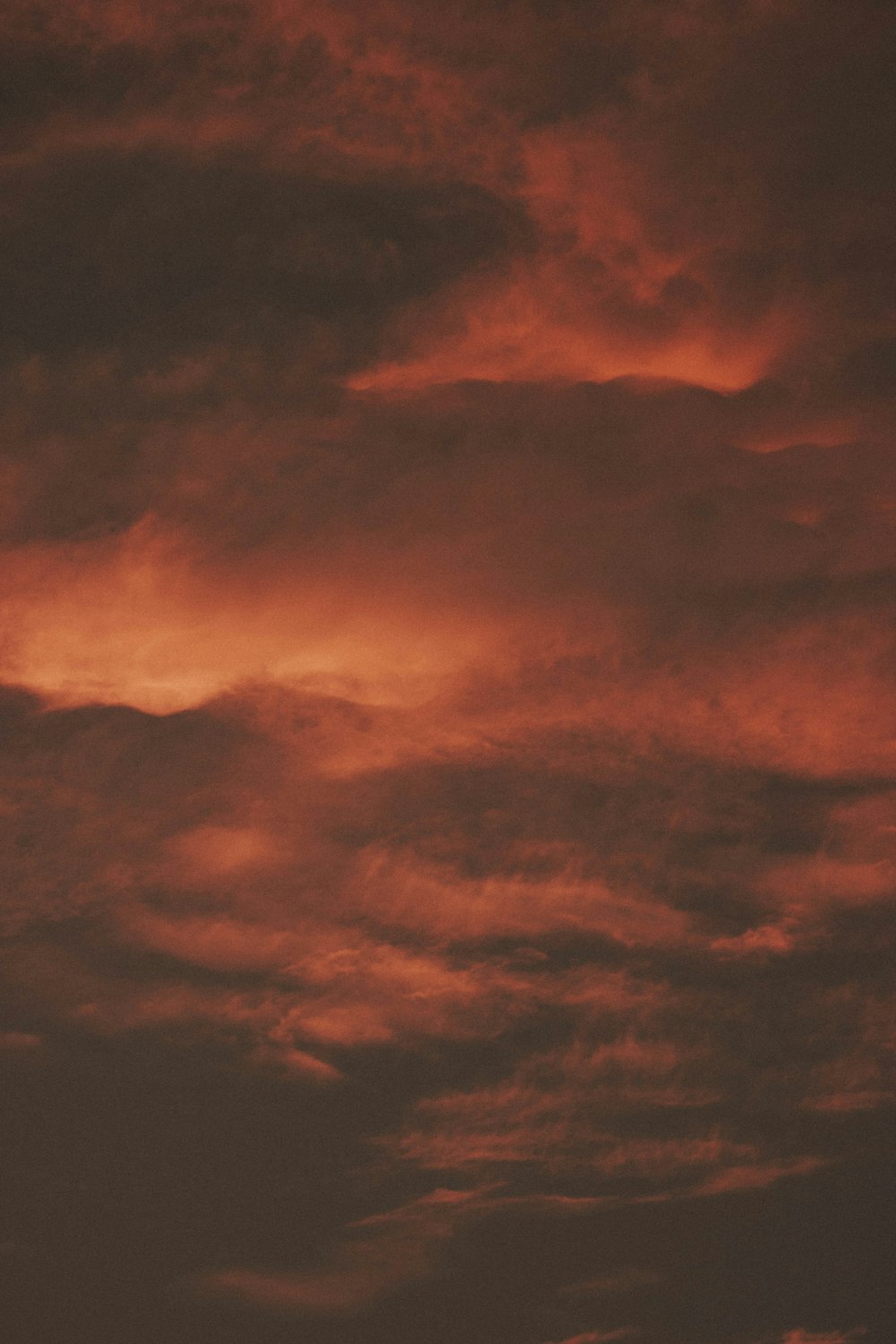 maroon cloudy sky