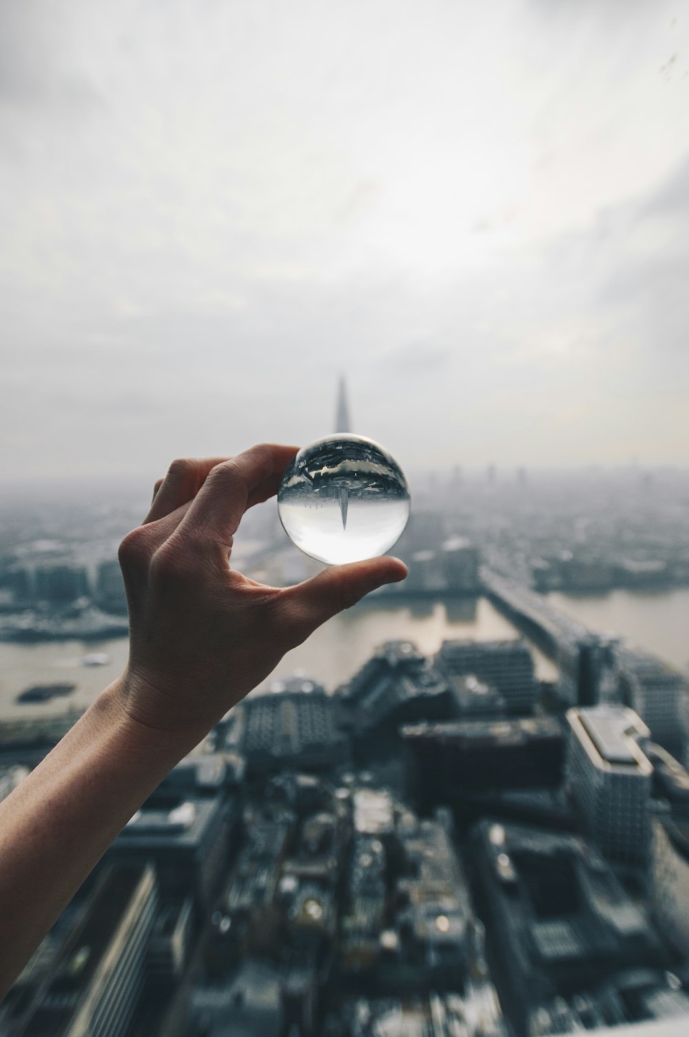 person holding clear ball