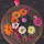 A close-up of a colorful bouquet of fresh flowers on a wooden table.